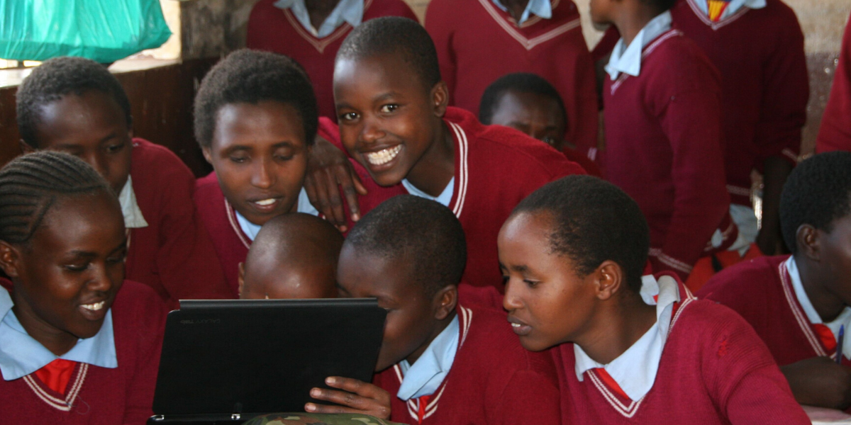 Children looking at Ipad